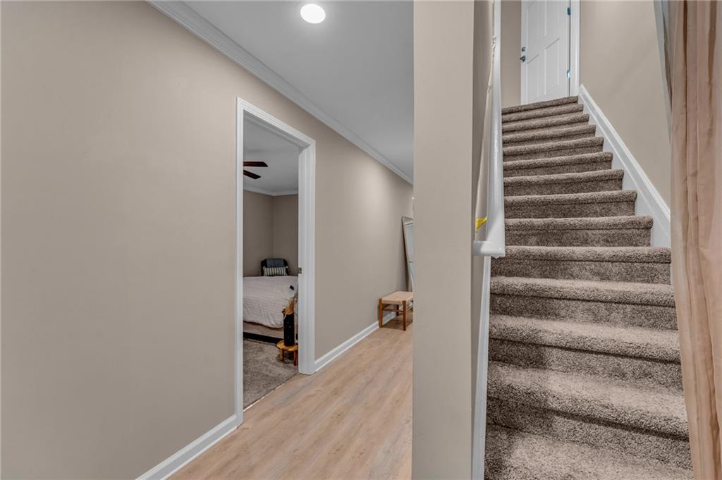 1093 3rd Street Stone Mountain, GA 30083 - Photo 24 of 43 a view of a hallway with wooden floor and staircase