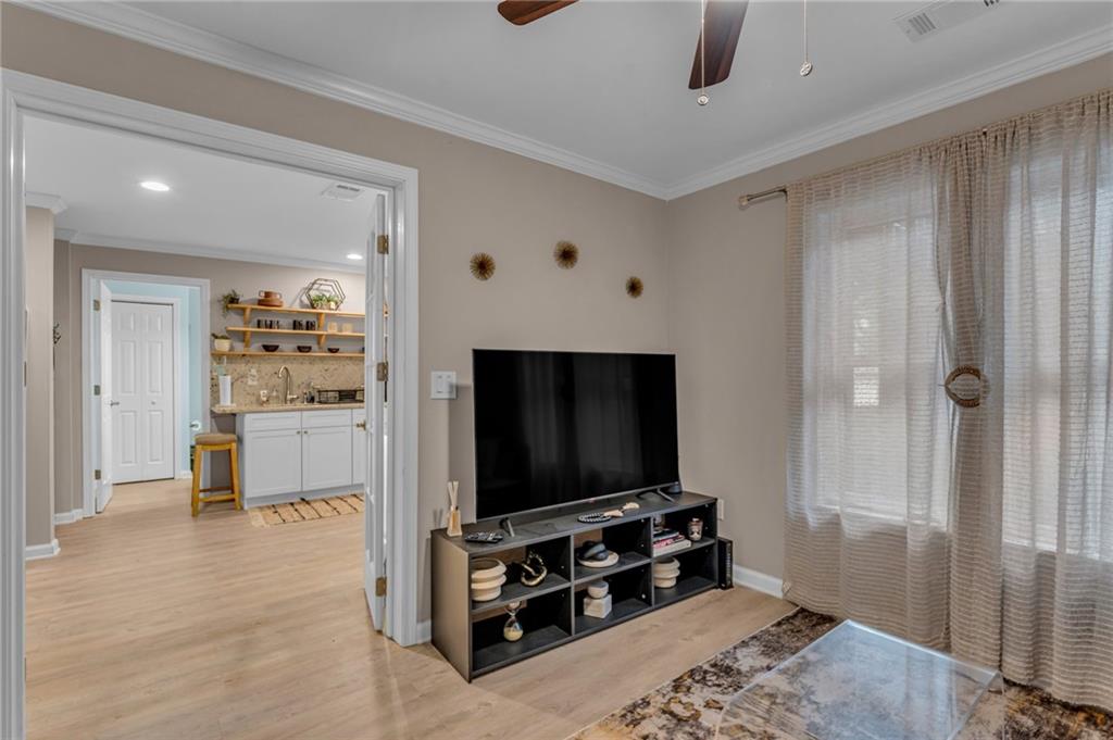 1093 3rd Street Stone Mountain, GA 30083 - Photo 31 of 43 a living room with flat screen tv and outdoor view