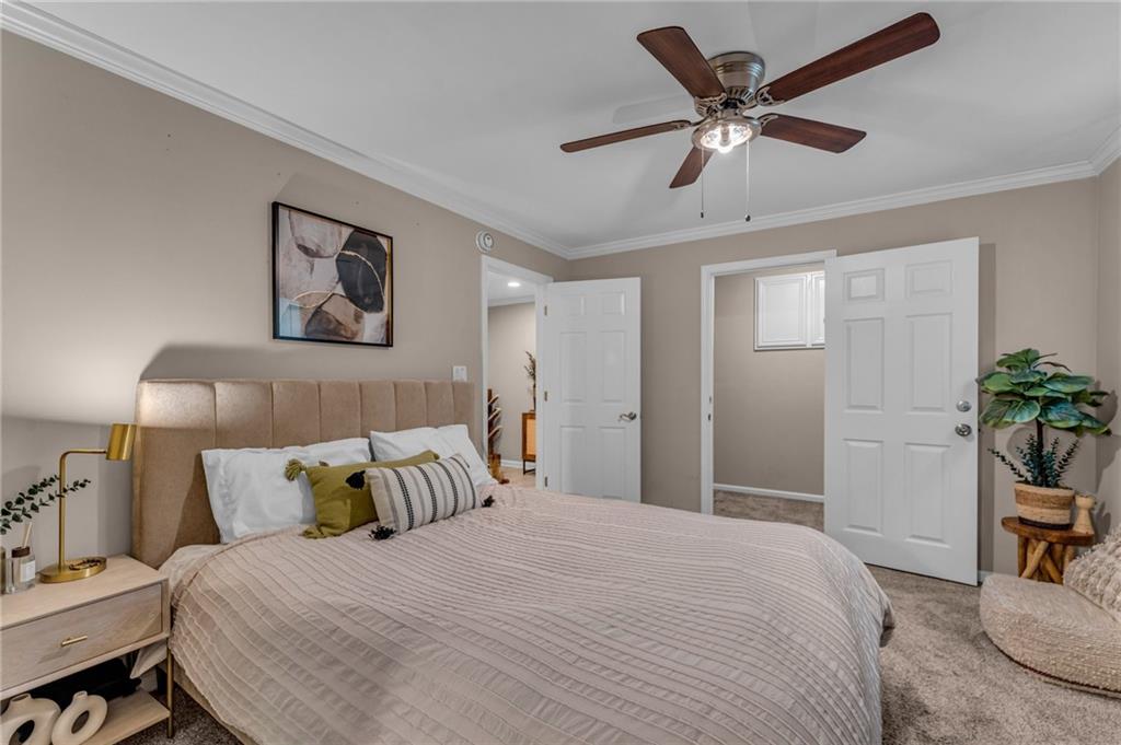 1093 3rd Street Stone Mountain, GA 30083 - Photo 33 of 43 a bedroom with a bed and a potted plant