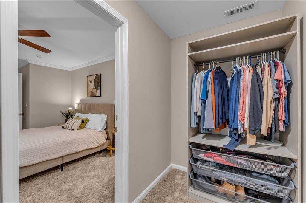 1093 3rd Street Stone Mountain, GA 30083 - Photo 36 of 43 a bedroom with a bed and a mirror