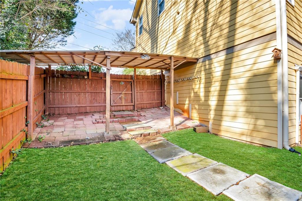 1093 3rd Street Stone Mountain, GA 30083 - Photo 39 of 43 a view of a backyard with a garden