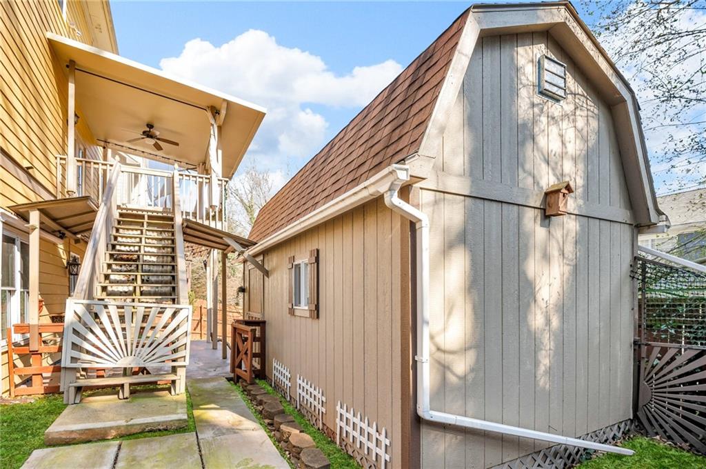 1093 3rd Street Stone Mountain, GA 30083 - Photo 40 of 43 a view of a balcony with furniture and the front door