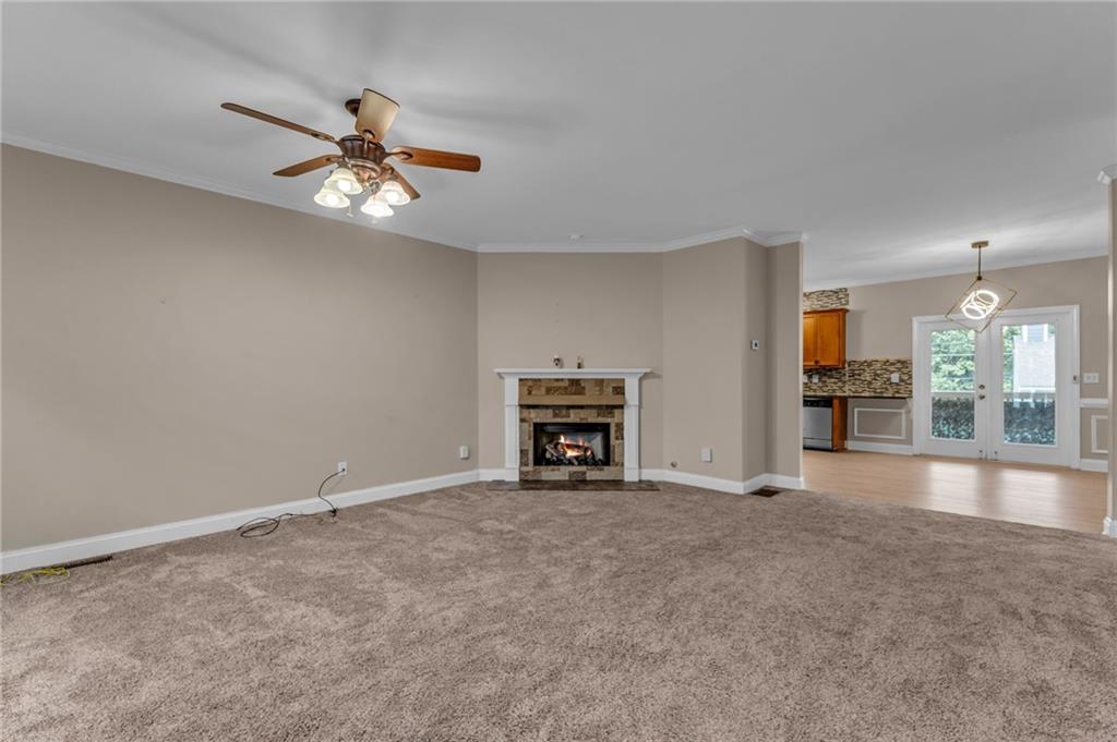 1093 3rd Street Stone Mountain, GA 30083 - Photo 4 of 43 an empty room with windows and fireplace