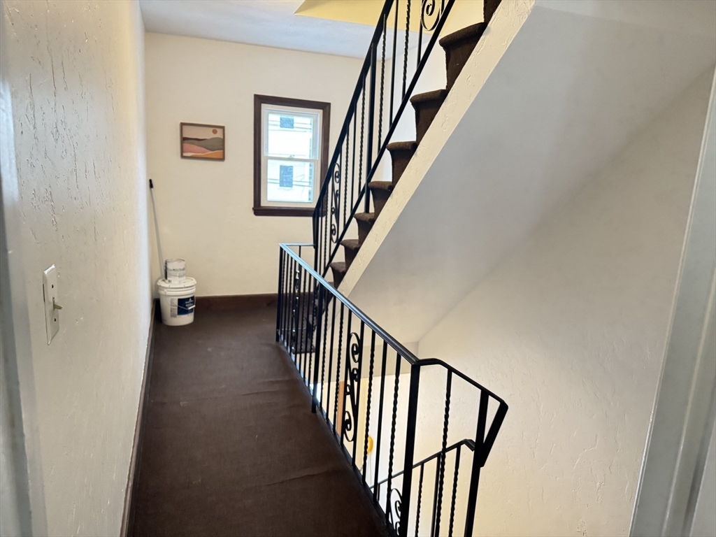 13 Murray Court, Unit 1 Boston, MA 02128 - Photo 17 of 22 a view of staircase with wooden floor and stairs