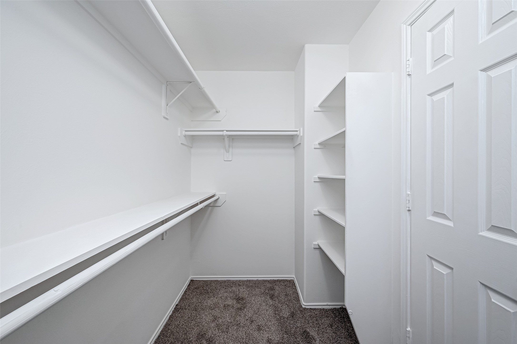 6906 Anson Point Lane Houston, TX 77040 - Photo 25 of 31 a hallway with walk in closet