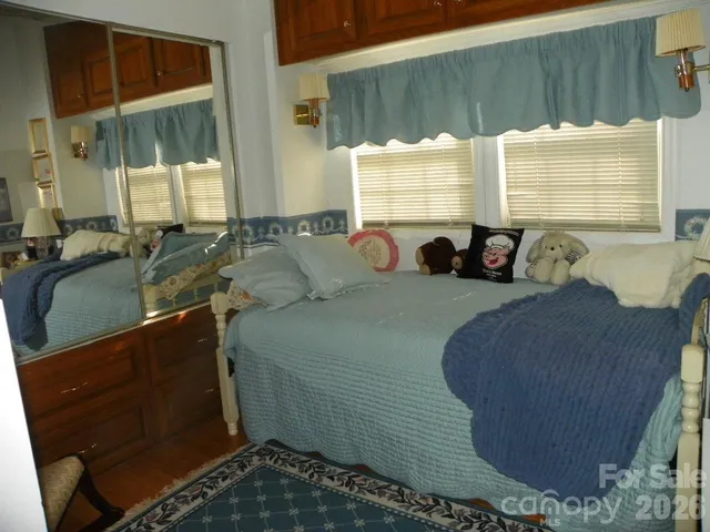 a living room with furniture and painting on the wall