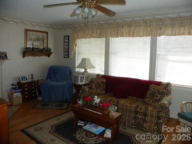 a view of a dining room with furniture and window