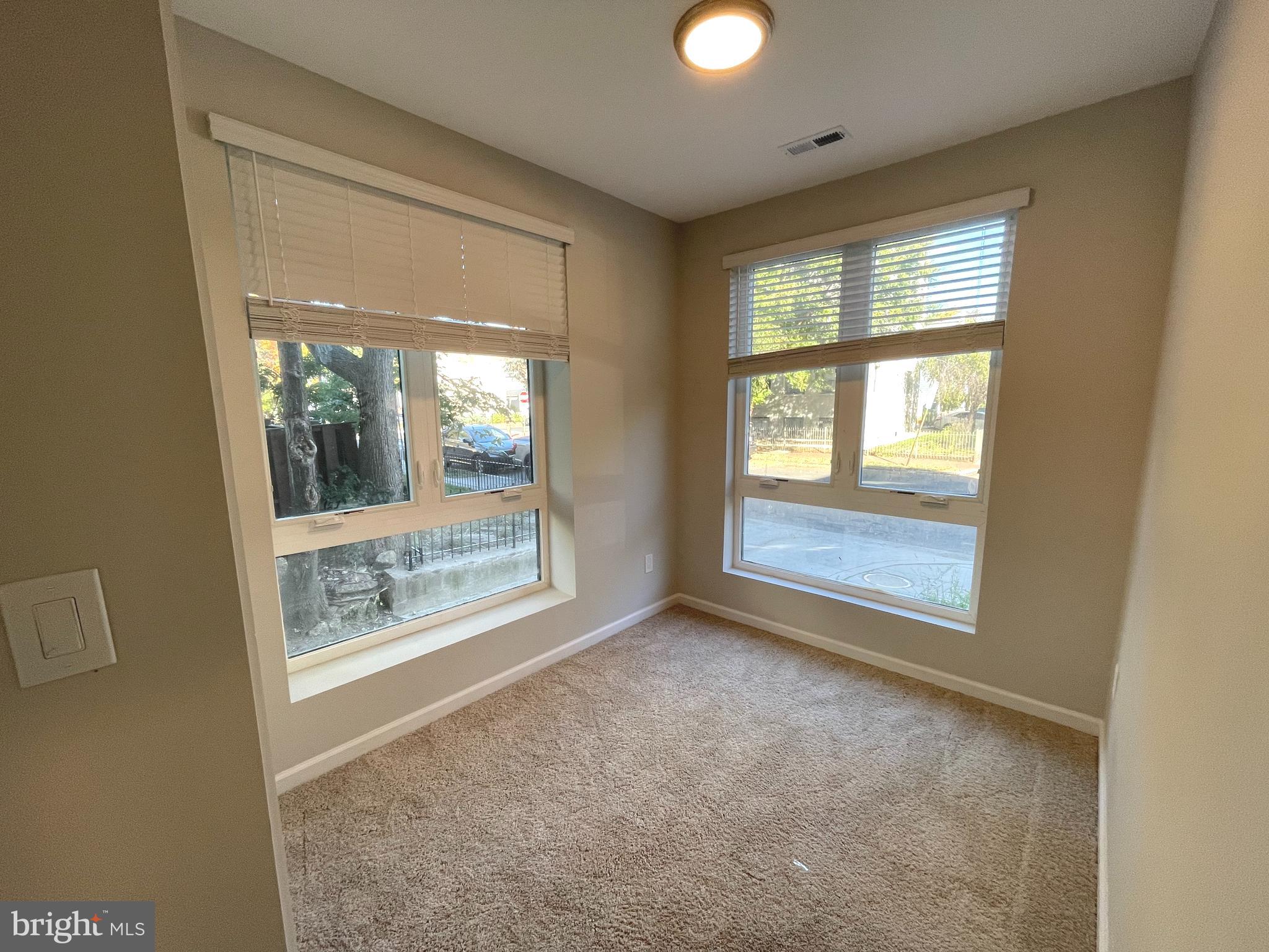 1307 K Street Southeast, Unit 101 Washington, DC 20003 - Photo 5 of 8 a view of an empty room with a window