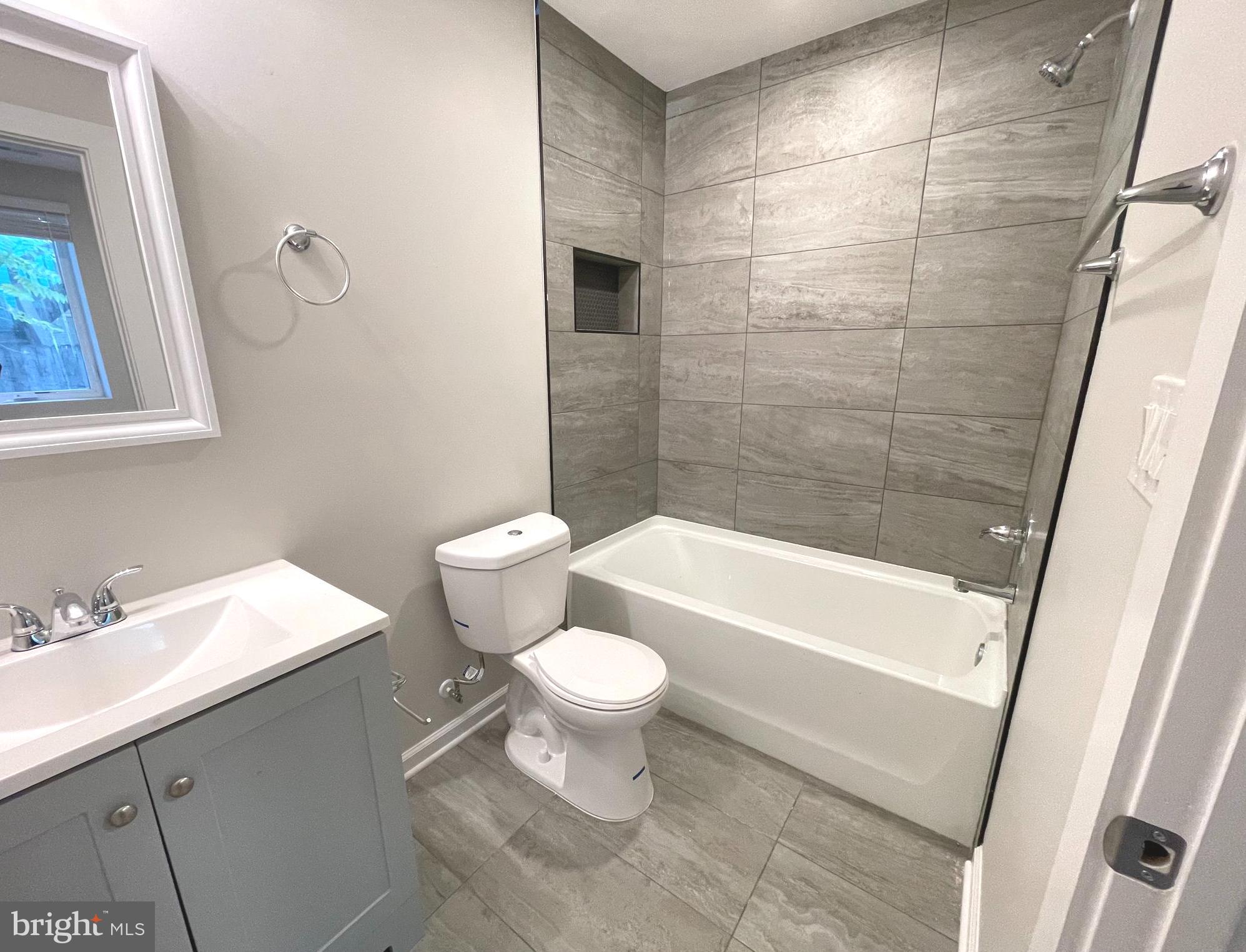 1307 K Street Southeast, Unit 101 Washington, DC 20003 - Photo 8 of 8 a bathroom with a sink a toilet and a bathtub