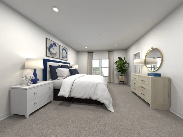 a spacious bedroom with a bed and a dresser