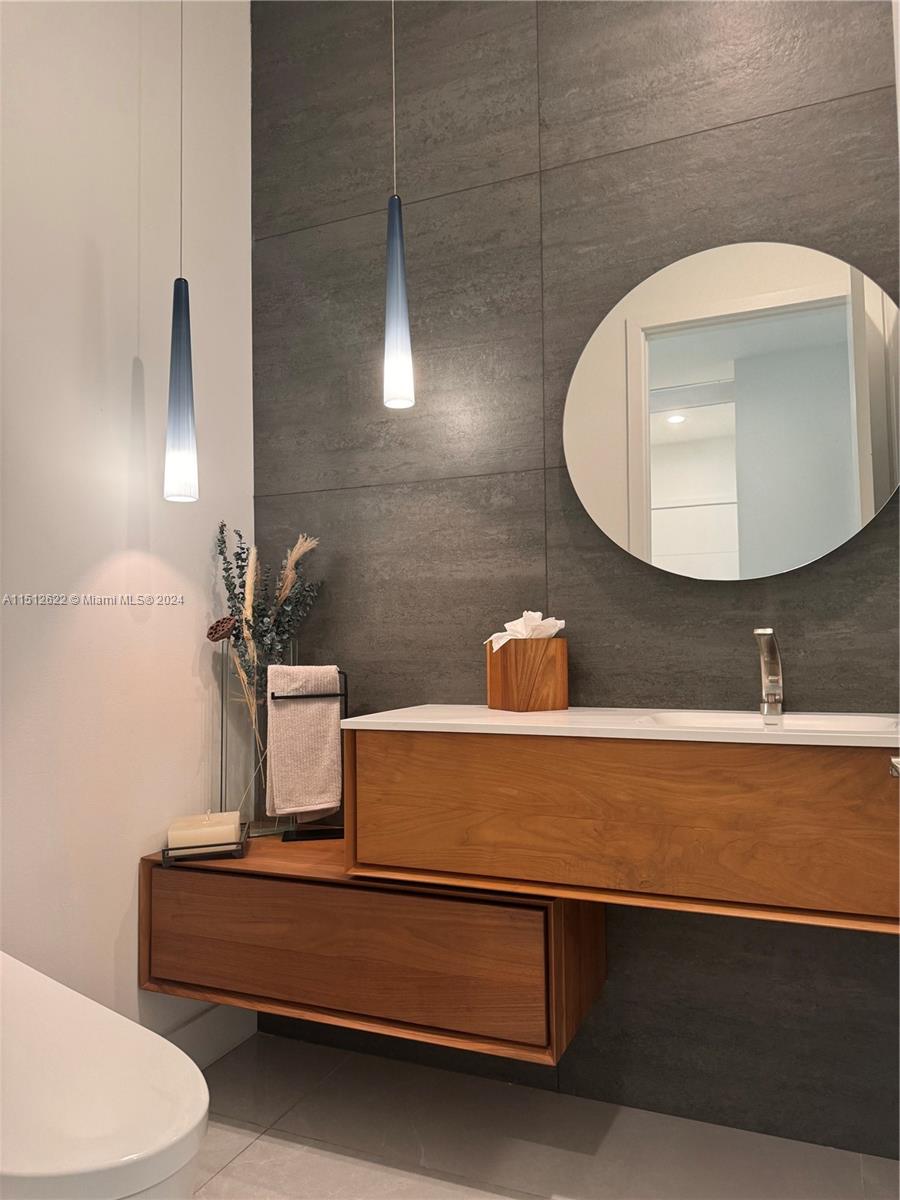 8636 Dearborn River Way Boca Raton, FL 33496 - Photo 14 of 25 a bathroom with a sink and a mirror