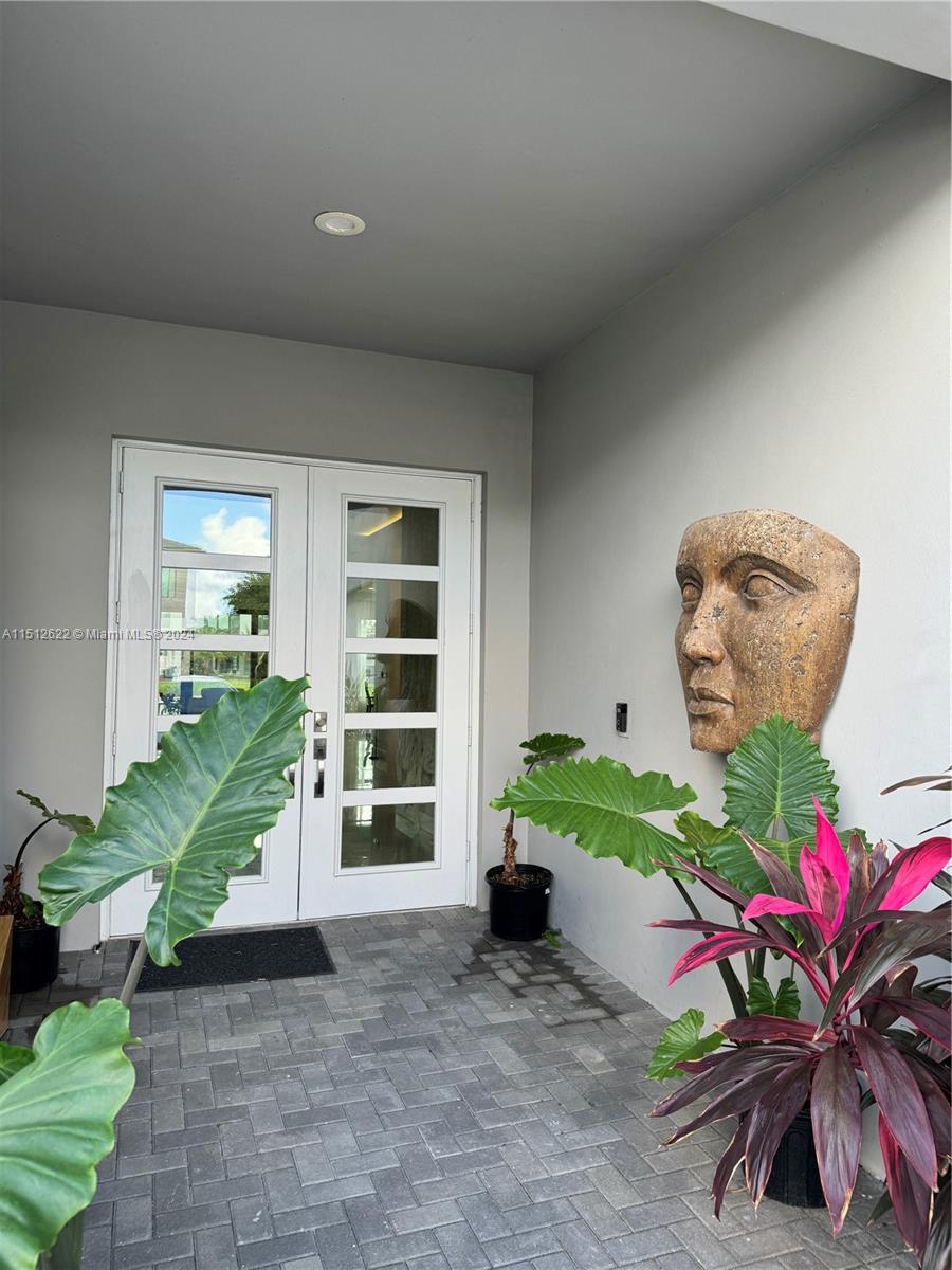 8636 Dearborn River Way Boca Raton, FL 33496 - Photo 2 of 25 a living room with garden