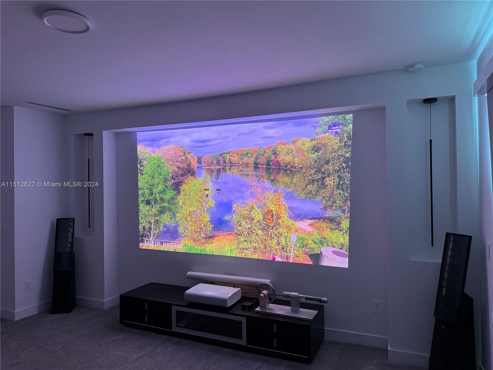 8636 Dearborn River Way Boca Raton, FL 33496 - Photo 23 of 25 a room with furniture projector and screen