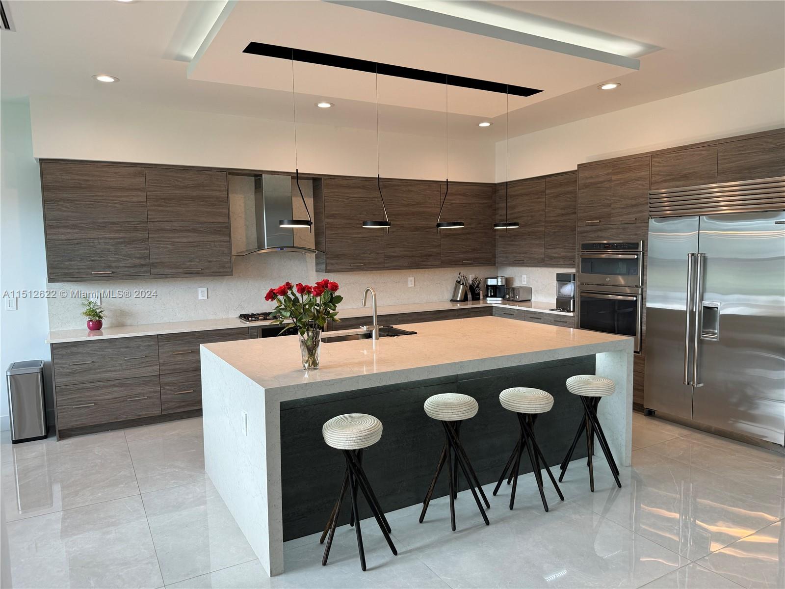 8636 Dearborn River Way Boca Raton, FL 33496 - Photo 8 of 25 a kitchen with stainless steel appliances granite countertop a sink a stove and a refrigerator