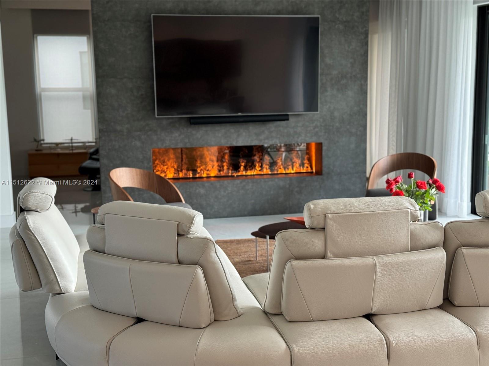 8636 Dearborn River Way Boca Raton, FL 33496 - Photo 9 of 25 a living room with furniture and a flat screen tv