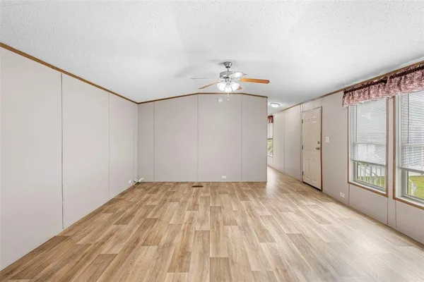 a view of an empty room with glass door