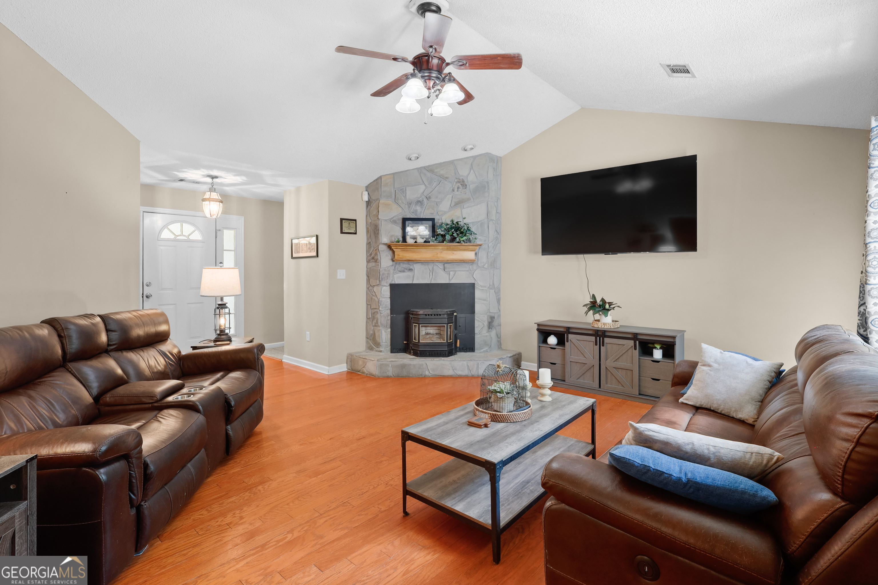 136 Quail Knoll Road Danville, GA 31017 - Photo 12 of 49 a living room with furniture and a flat screen tv