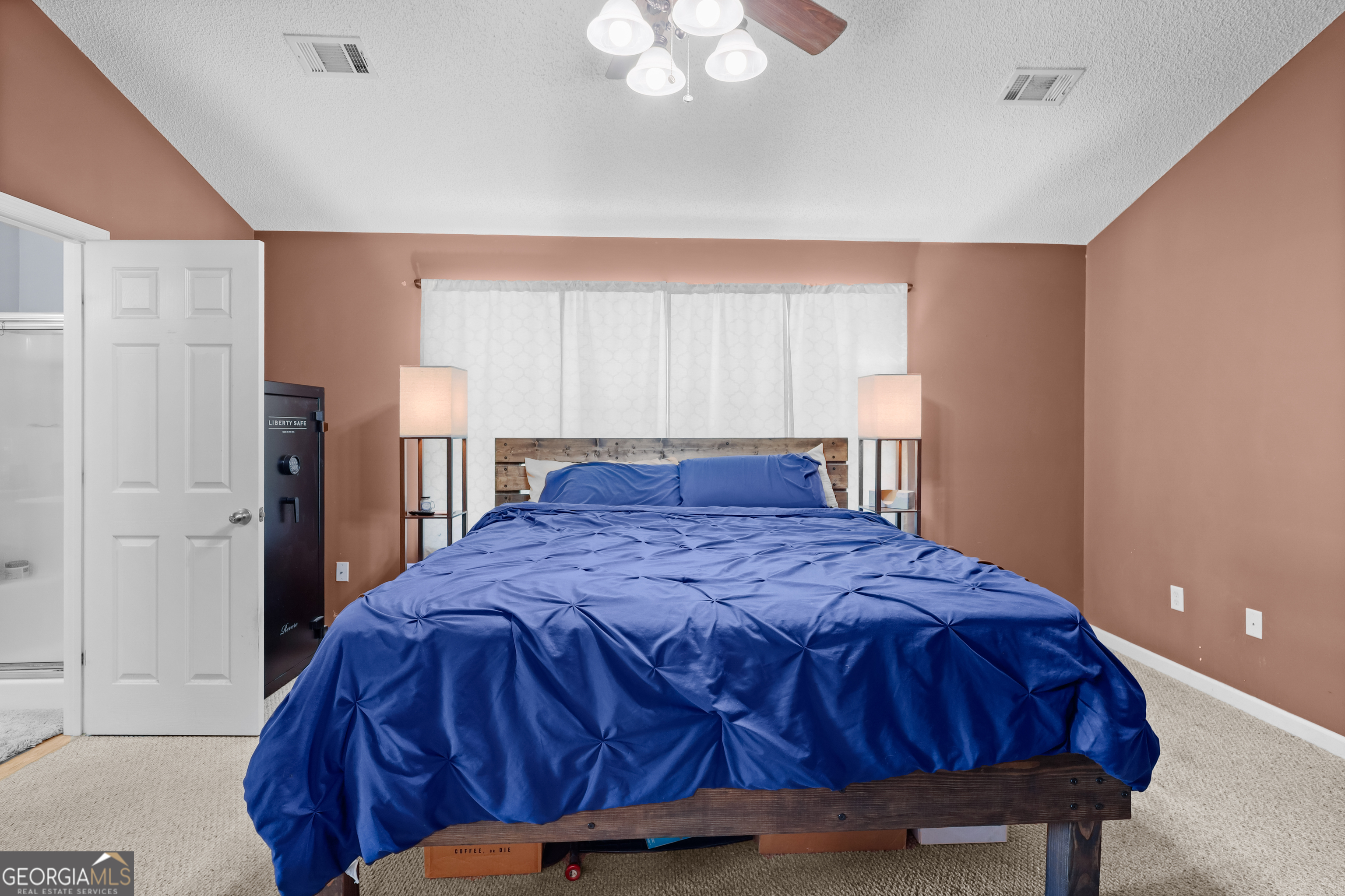 136 Quail Knoll Road Danville, GA 31017 - Photo 19 of 49 a bedroom with a bed and a window