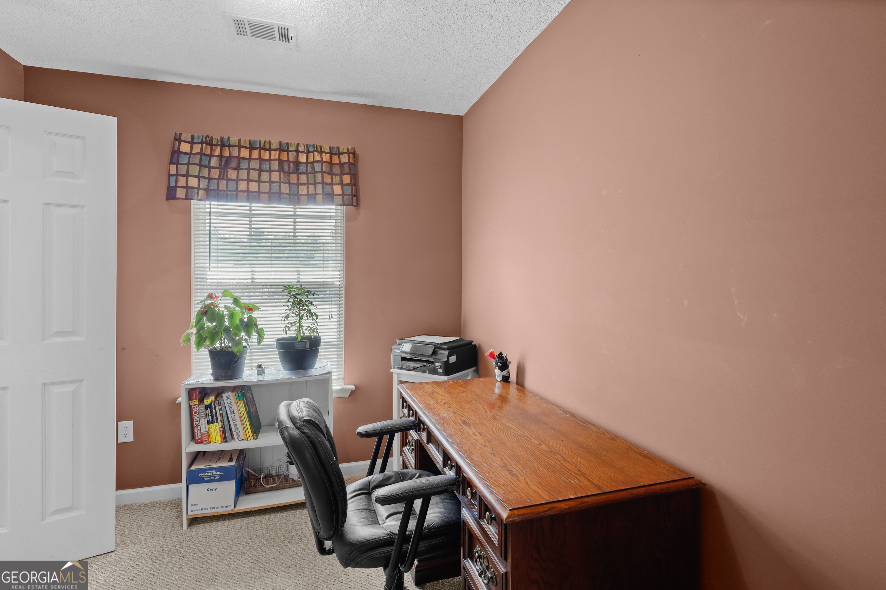 136 Quail Knoll Road Danville, GA 31017 - Photo 21 of 49 a view of a room that has a table and chairs in it