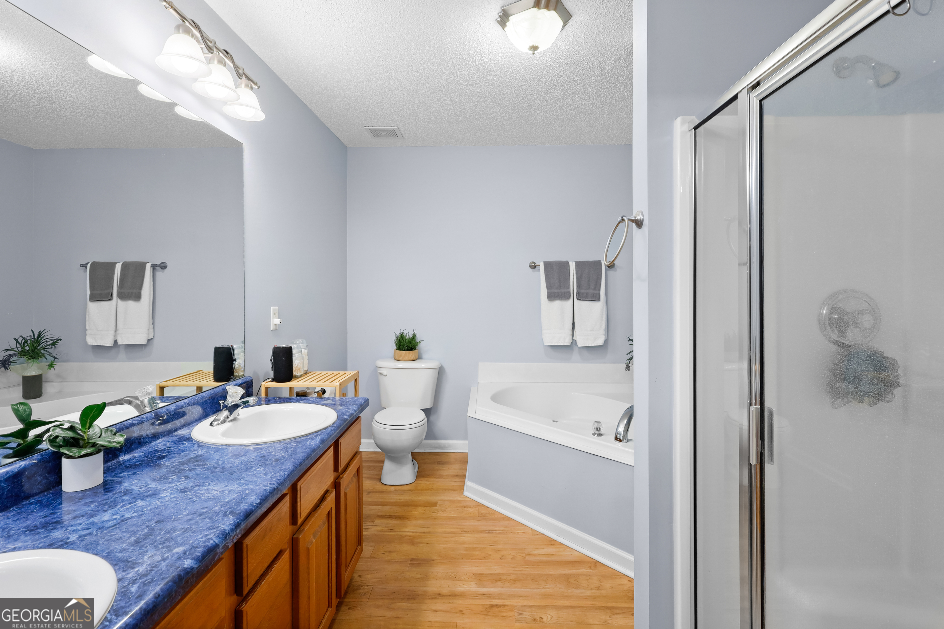 136 Quail Knoll Road Danville, GA 31017 - Photo 23 of 49 a bathroom with a tub sink and mirror