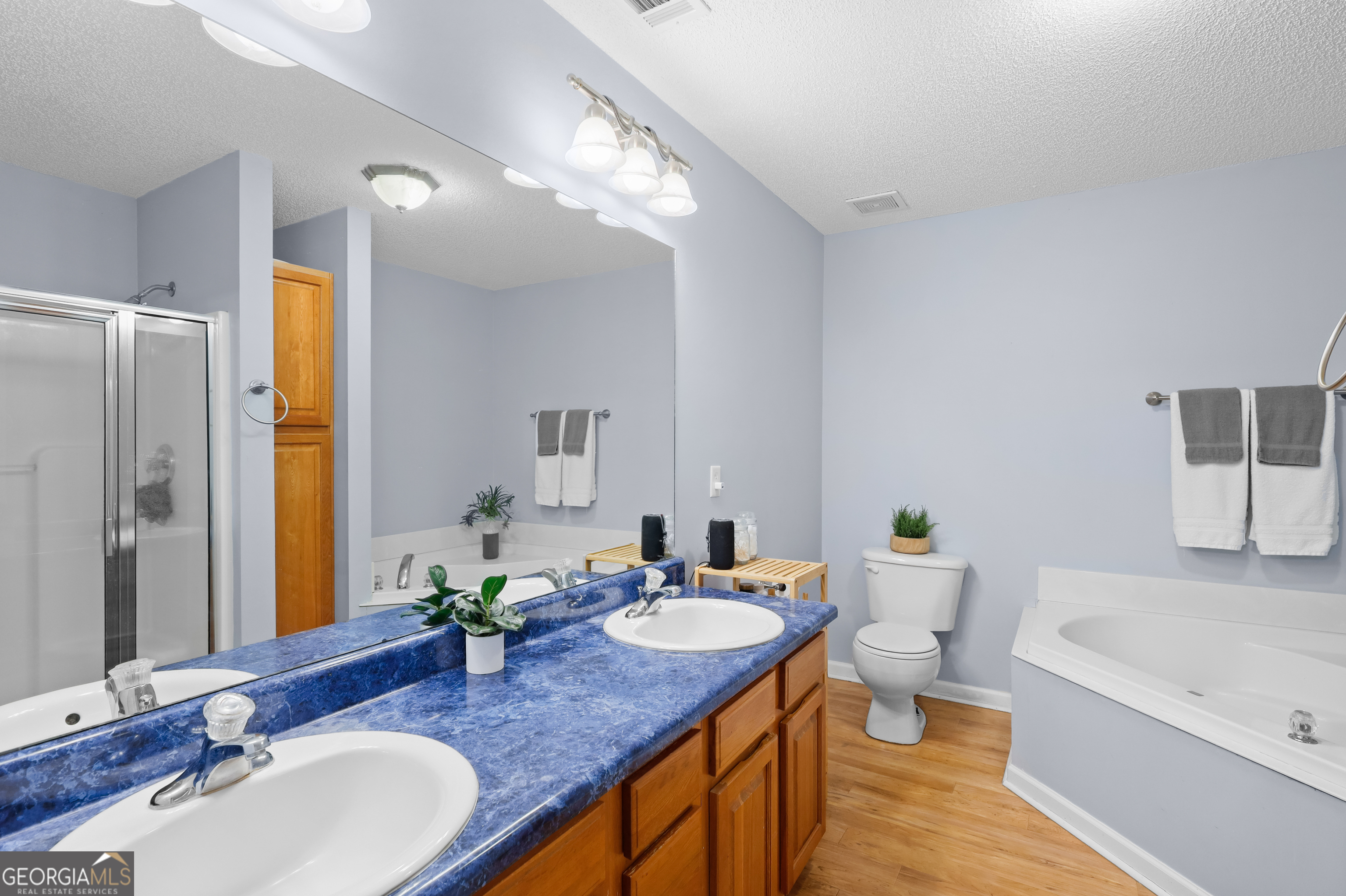 136 Quail Knoll Road Danville, GA 31017 - Photo 24 of 49 a bathroom with a granite countertop sink and a mirror