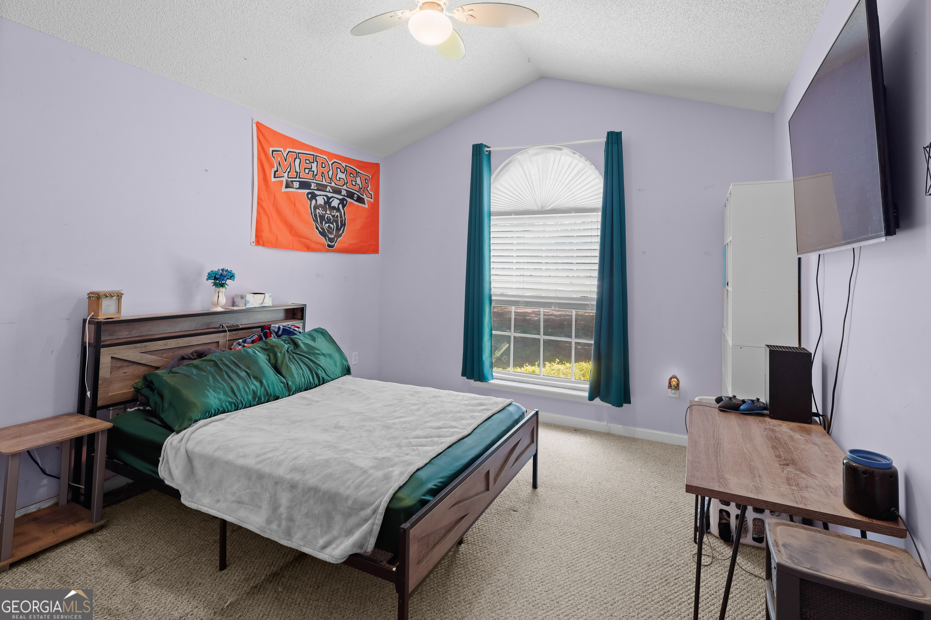 136 Quail Knoll Road Danville, GA 31017 - Photo 26 of 49 a bedroom with a bed and a flat screen tv