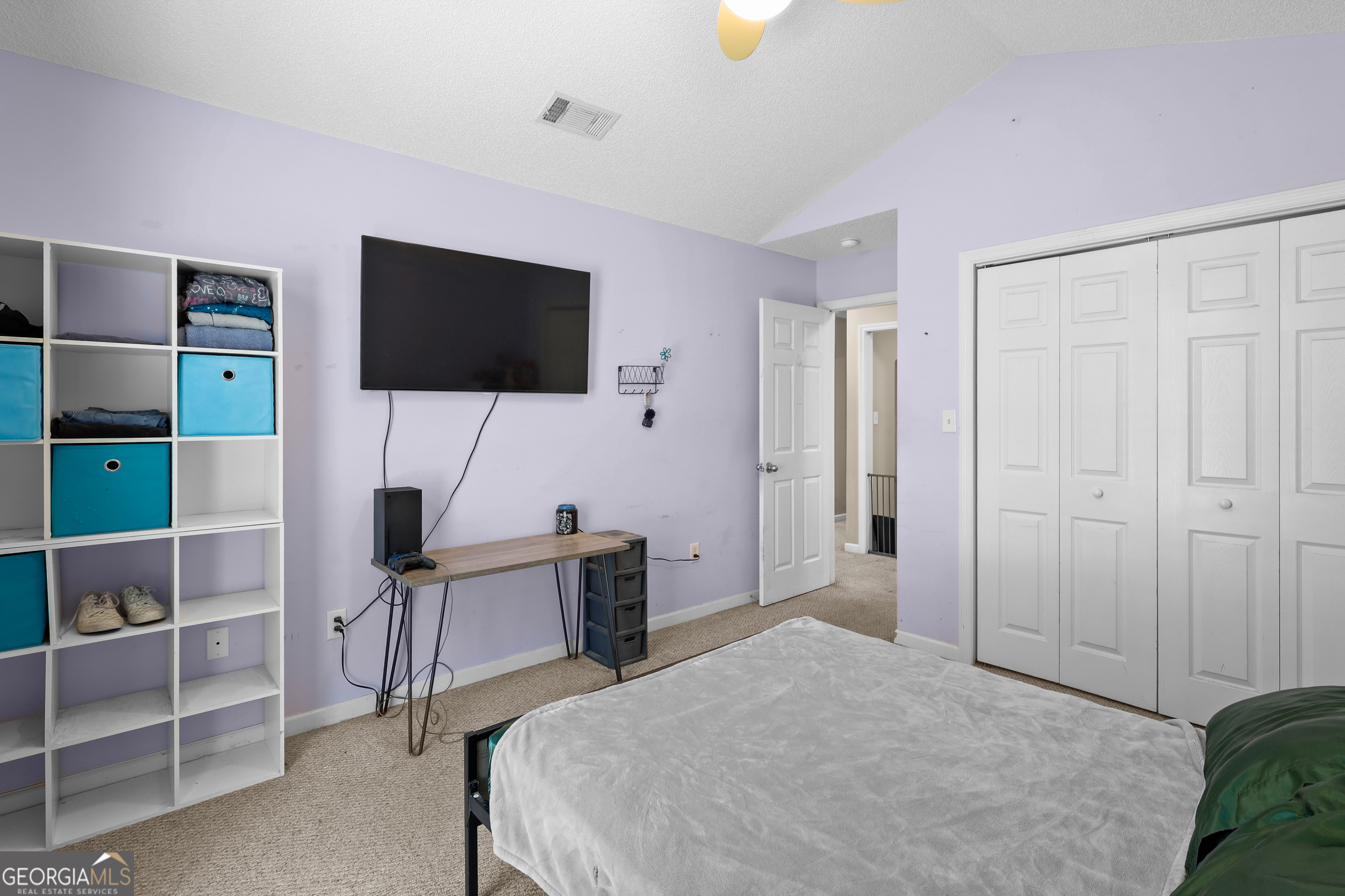 136 Quail Knoll Road Danville, GA 31017 - Photo 27 of 49 a bedroom with a bed and a flat screen tv