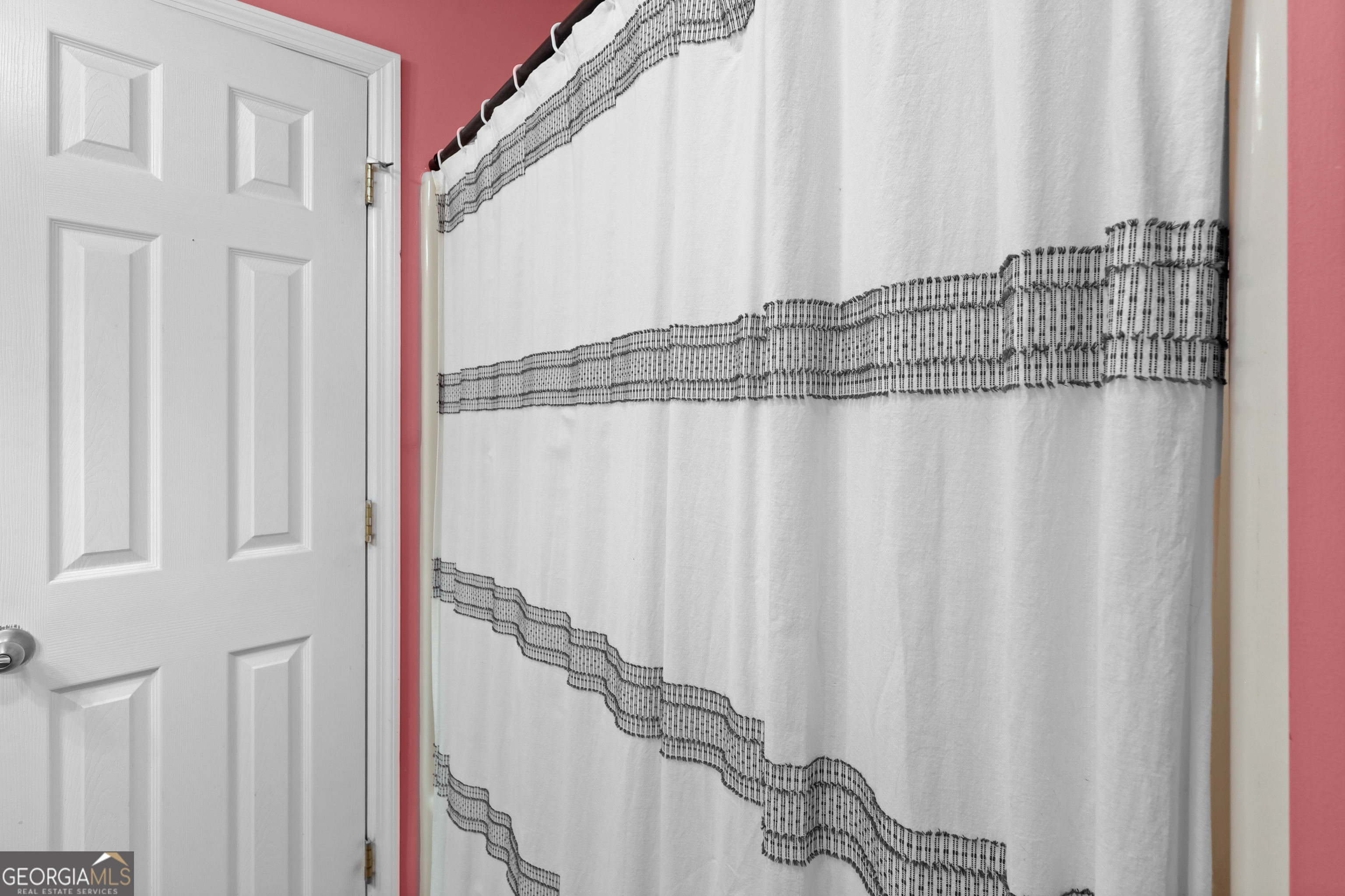 136 Quail Knoll Road Danville, GA 31017 - Photo 30 of 49 a view of a bathroom with shower and a window