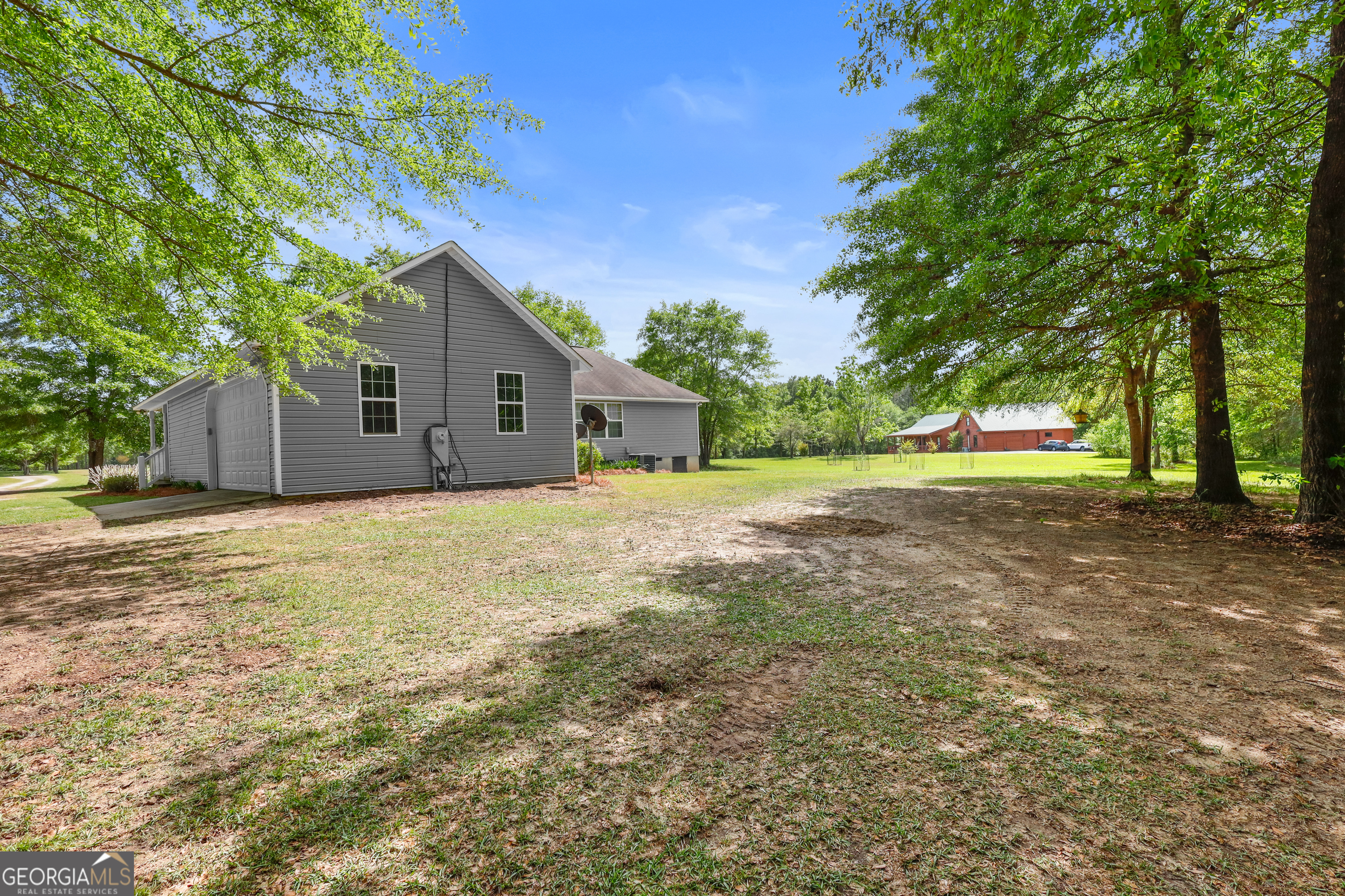 136 Quail Knoll Road Danville, GA 31017 - Photo 3 of 49 a front view of house with yard and trees