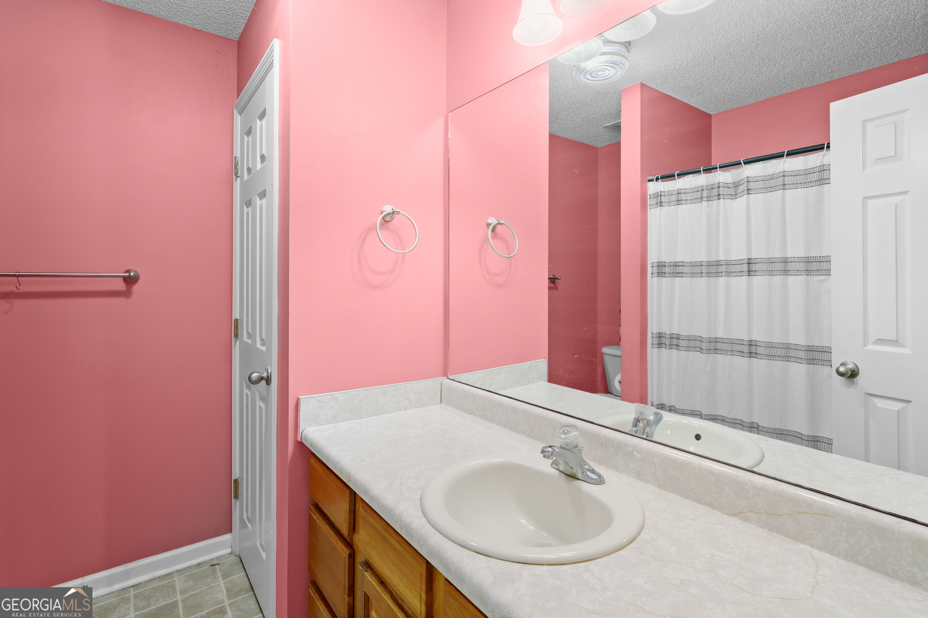 136 Quail Knoll Road Danville, GA 31017 - Photo 31 of 49 a bathroom with a sink and a mirror