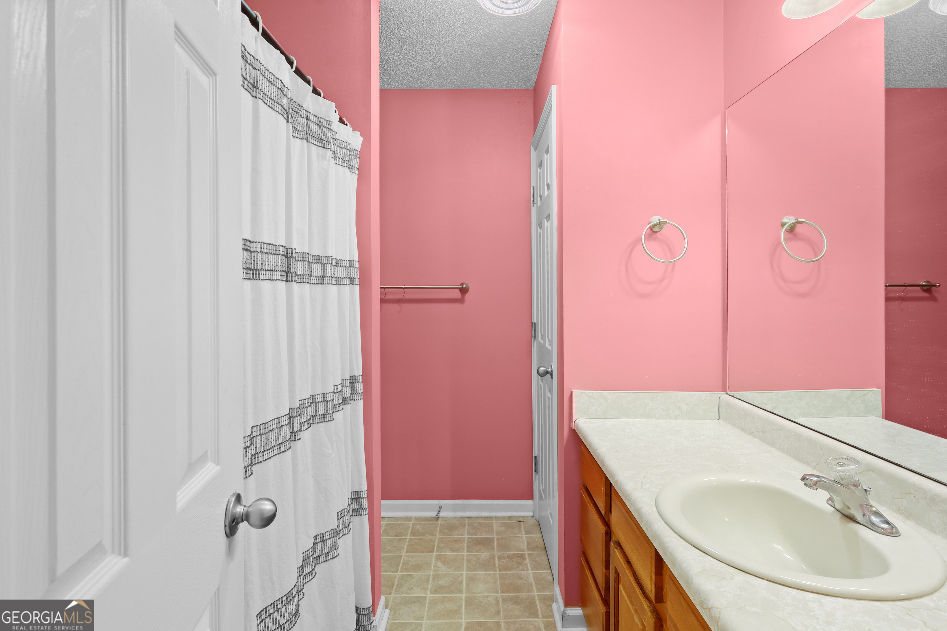 136 Quail Knoll Road Danville, GA 31017 - Photo 32 of 49 a bathroom with a sink and a mirror