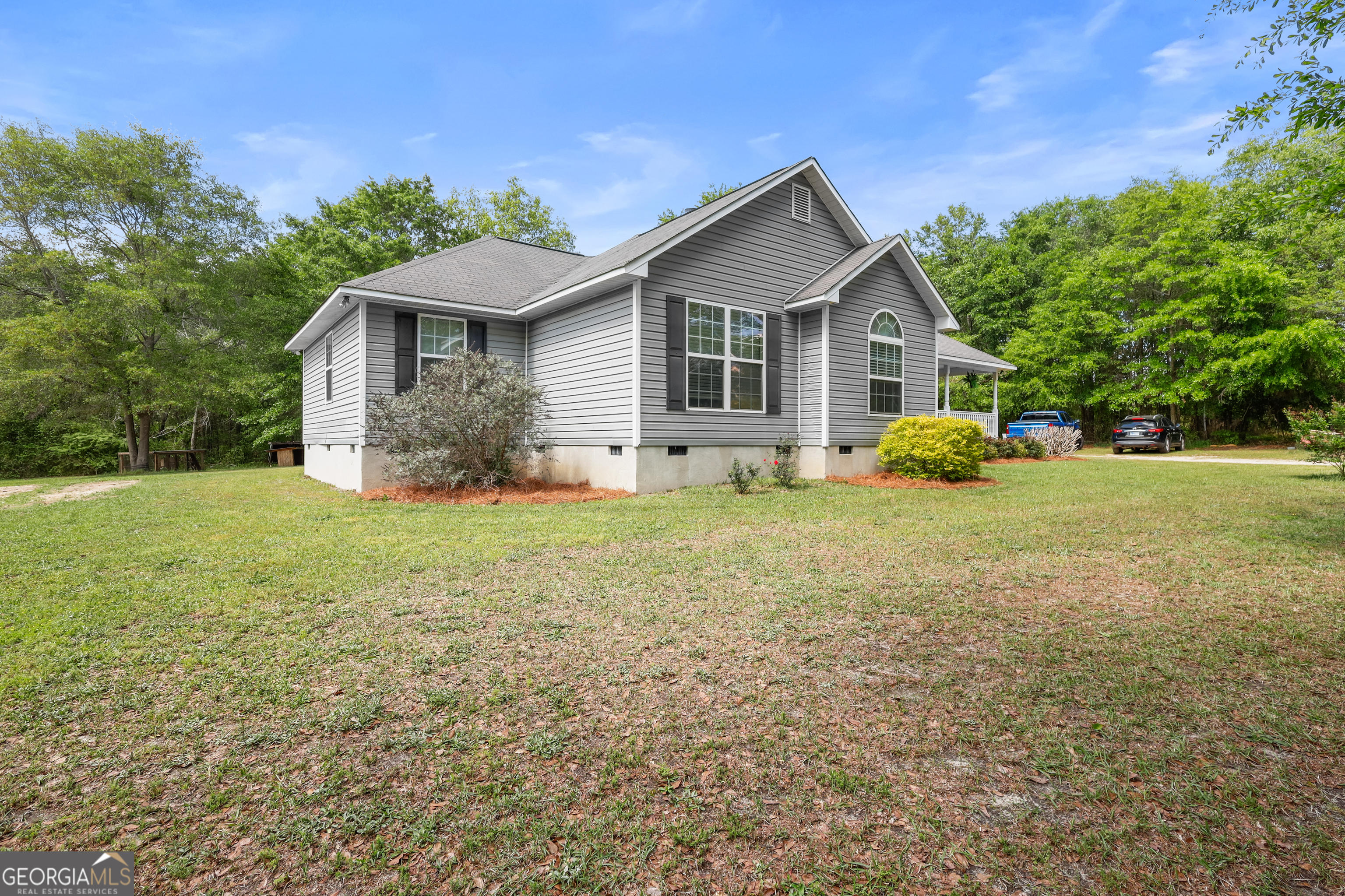 136 Quail Knoll Road Danville, GA 31017 - Photo 34 of 49 a front view of house with yard and green space