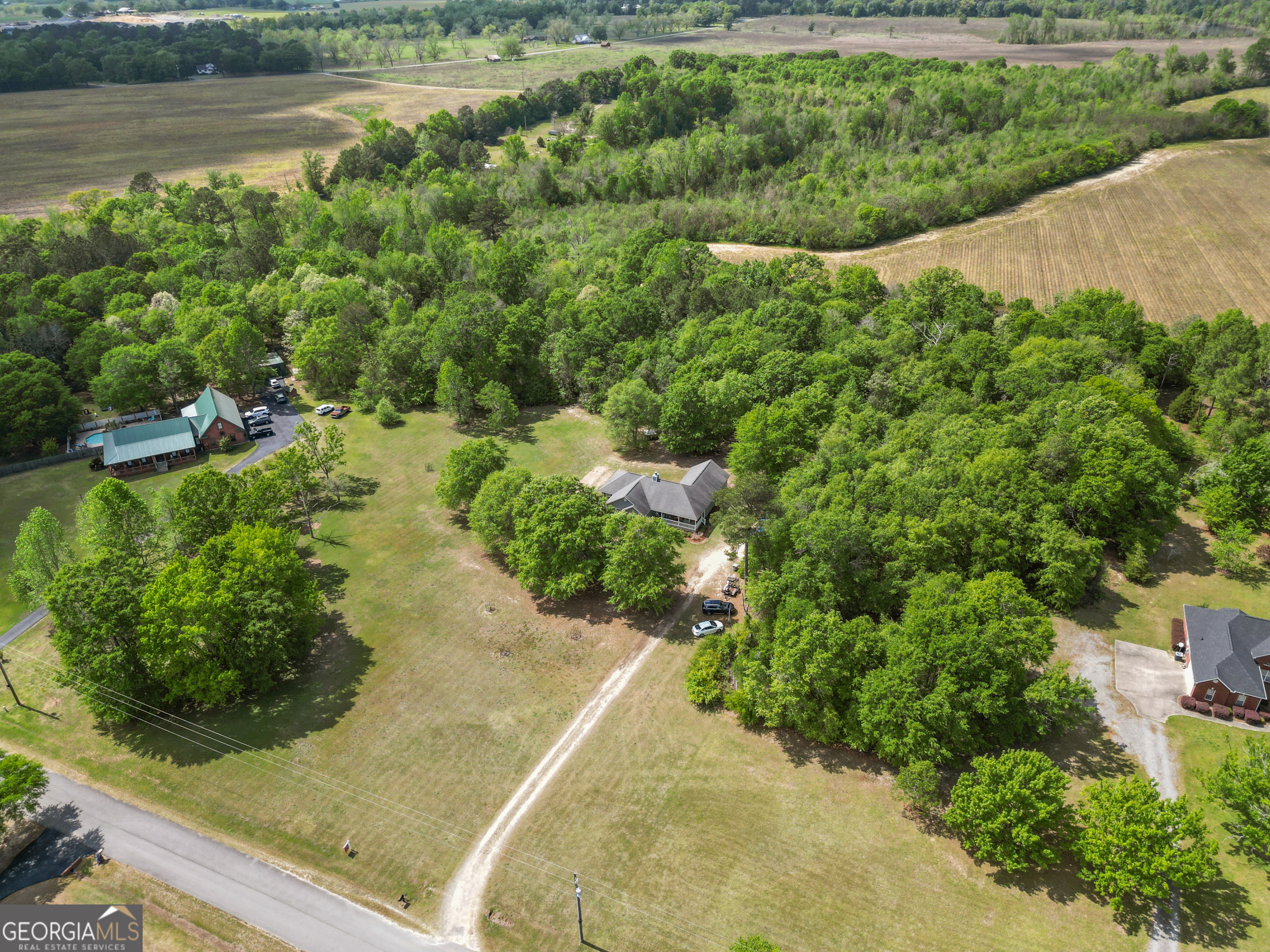 136 Quail Knoll Road Danville, GA 31017 - Photo 39 of 49 a view of a garden with a lake