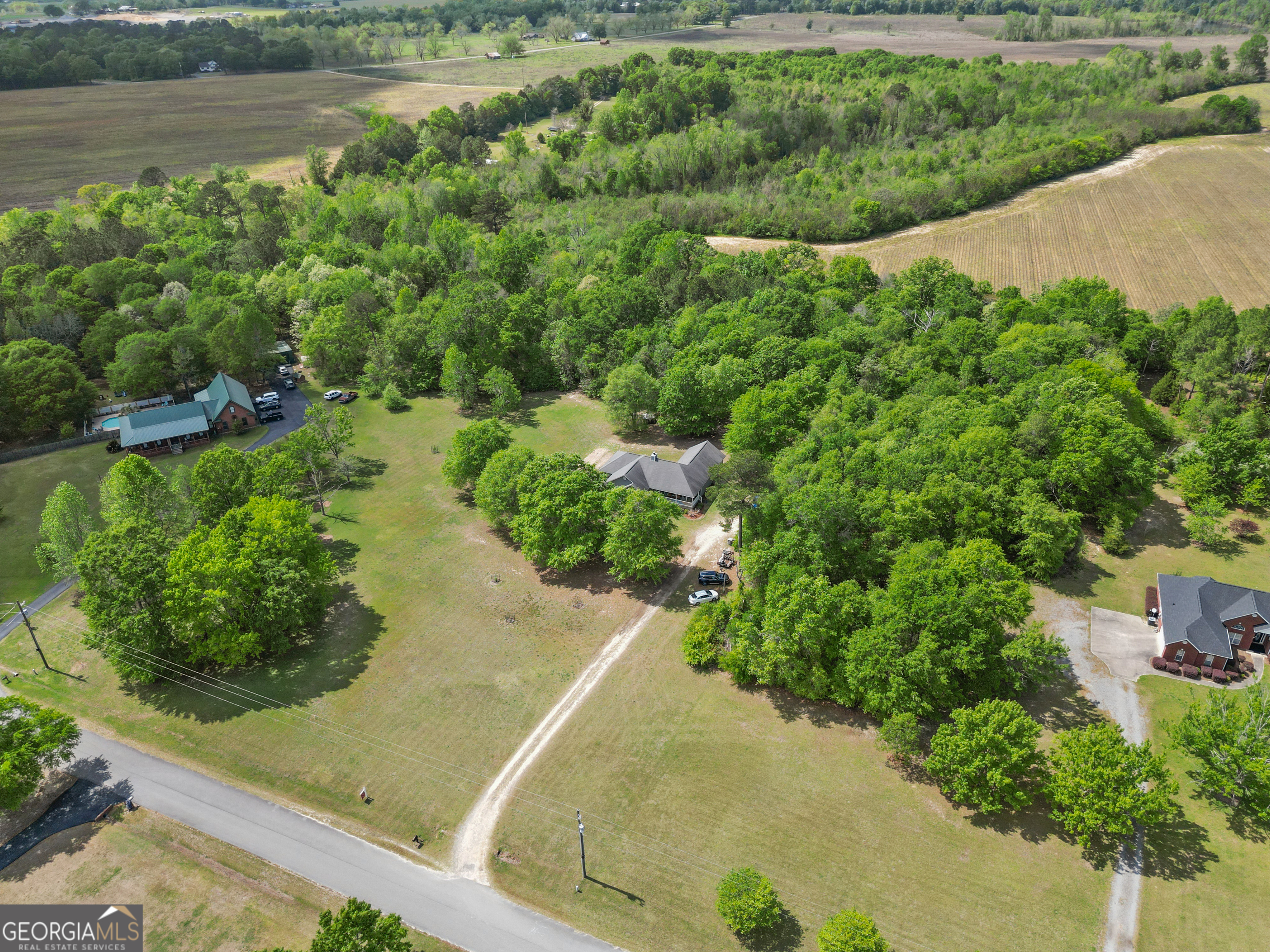136 Quail Knoll Road Danville, GA 31017 - Photo 40 of 49 a view of a garden with a lake