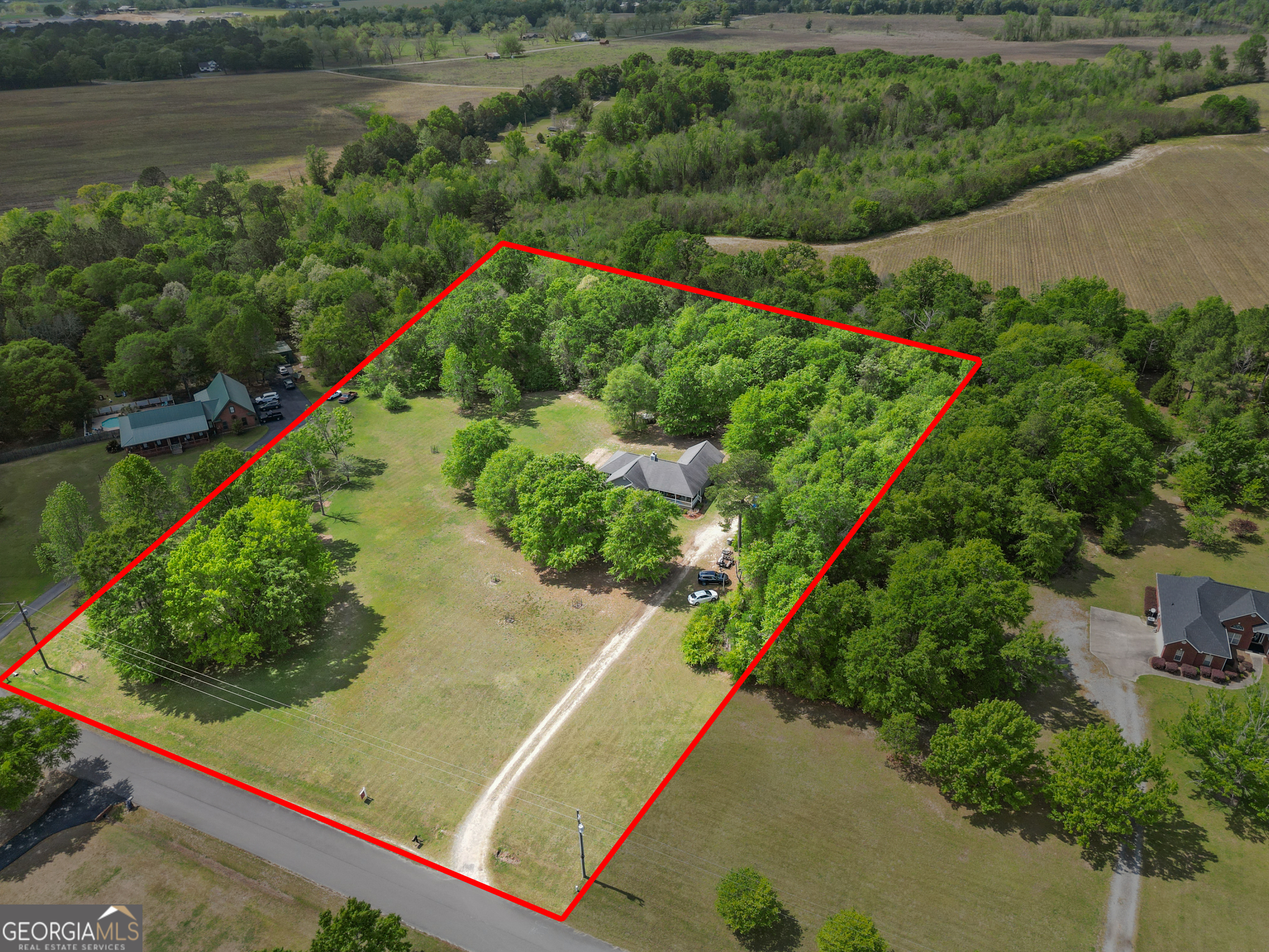 136 Quail Knoll Road Danville, GA 31017 - Photo 49 of 49 a view of a garden with a lake