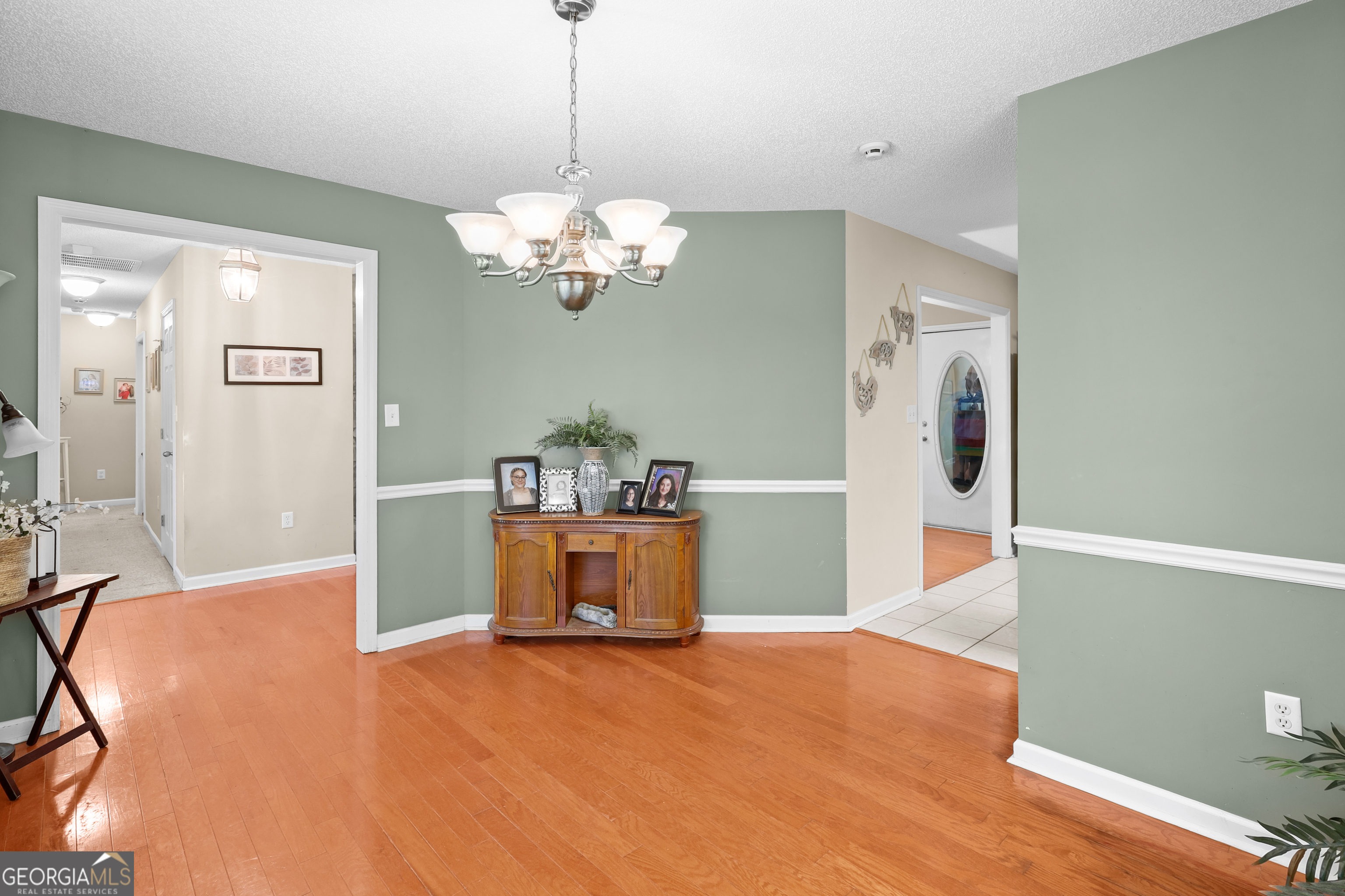 136 Quail Knoll Road Danville, GA 31017 - Photo 9 of 49 a view of a room with a cabinet and chandelier