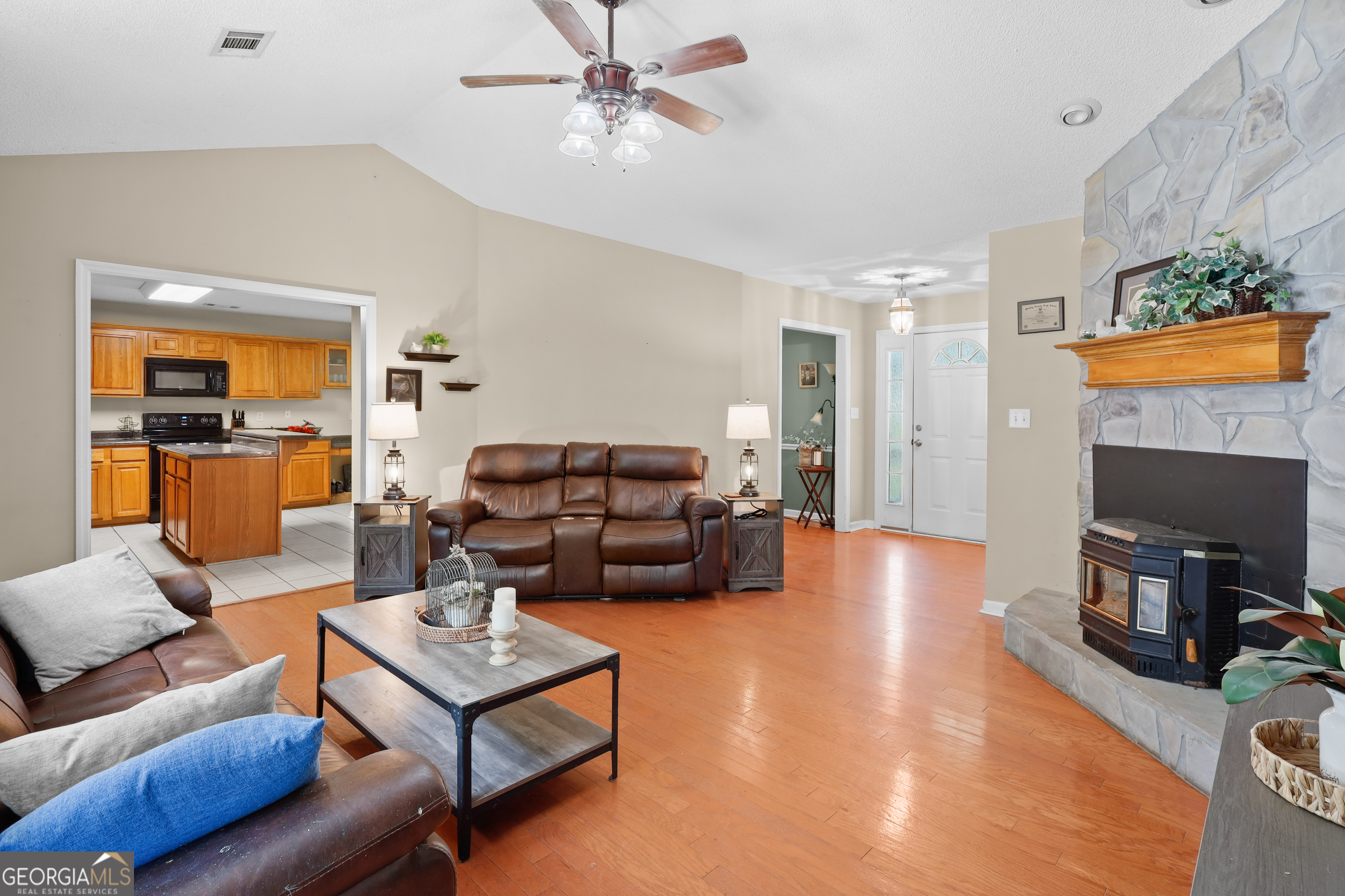 136 Quail Knoll Road Danville, GA 31017 - Photo 10 of 49 a living room with furniture and a fireplace