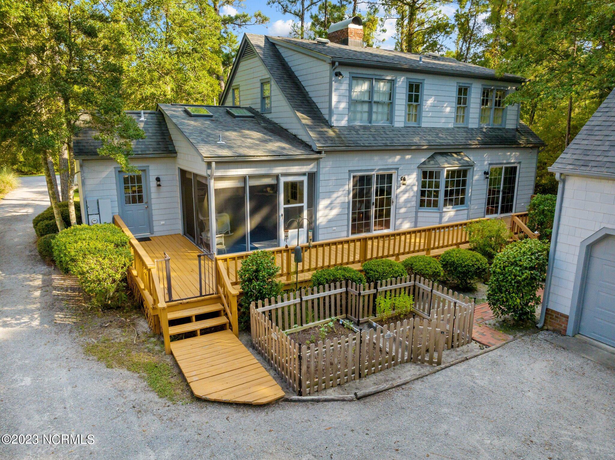 906 Point Court New Bern, NC 28560 - Photo 3 of 70 REAR DECK AND GARDEN