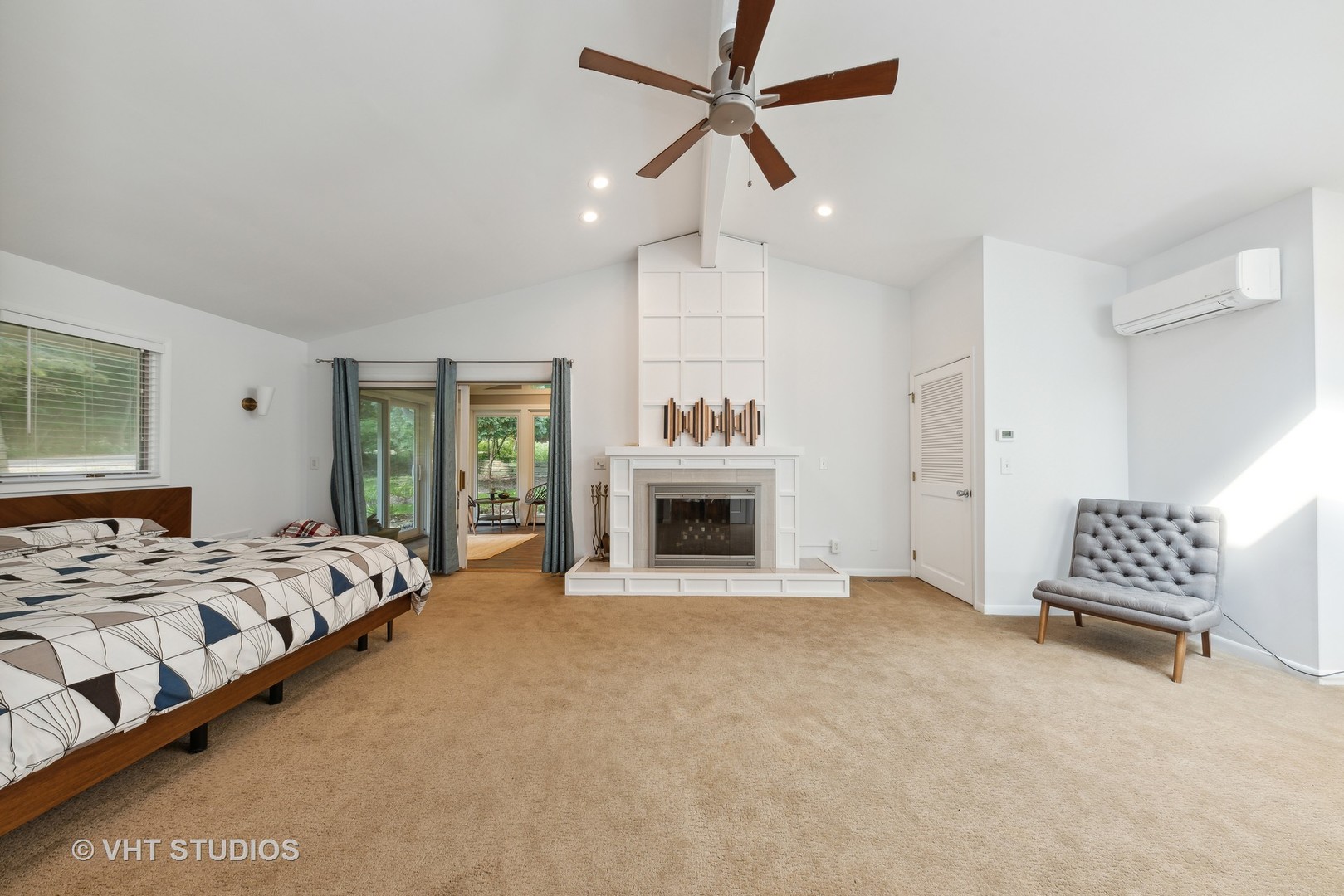 107 Trout Valley Road Trout Valley, IL 60013 - Photo 15 of 29 a spacious bedroom with a bed and a fireplace