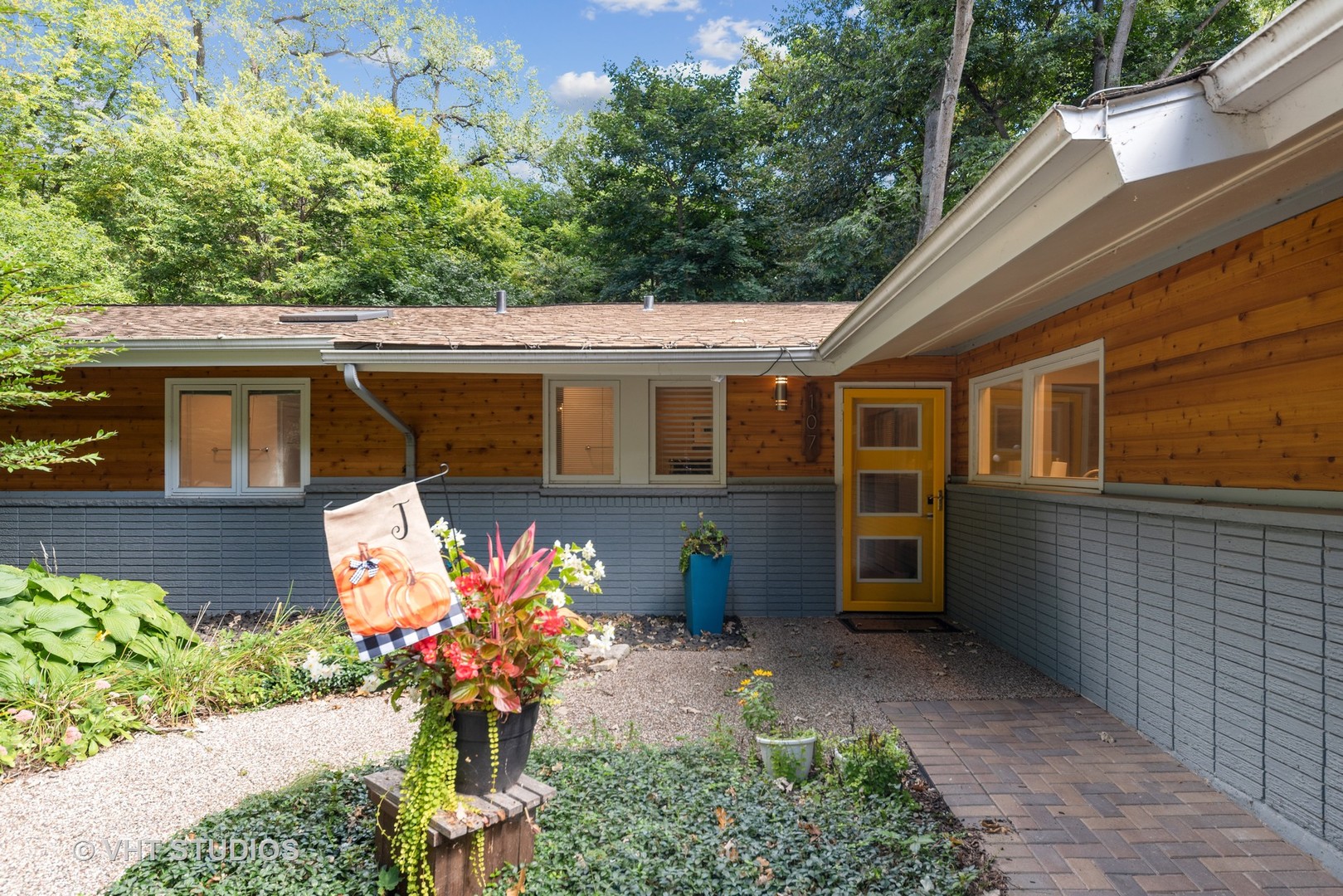 107 Trout Valley Road Trout Valley, IL 60013 - Photo 2 of 29 a house with a lot of flower plants