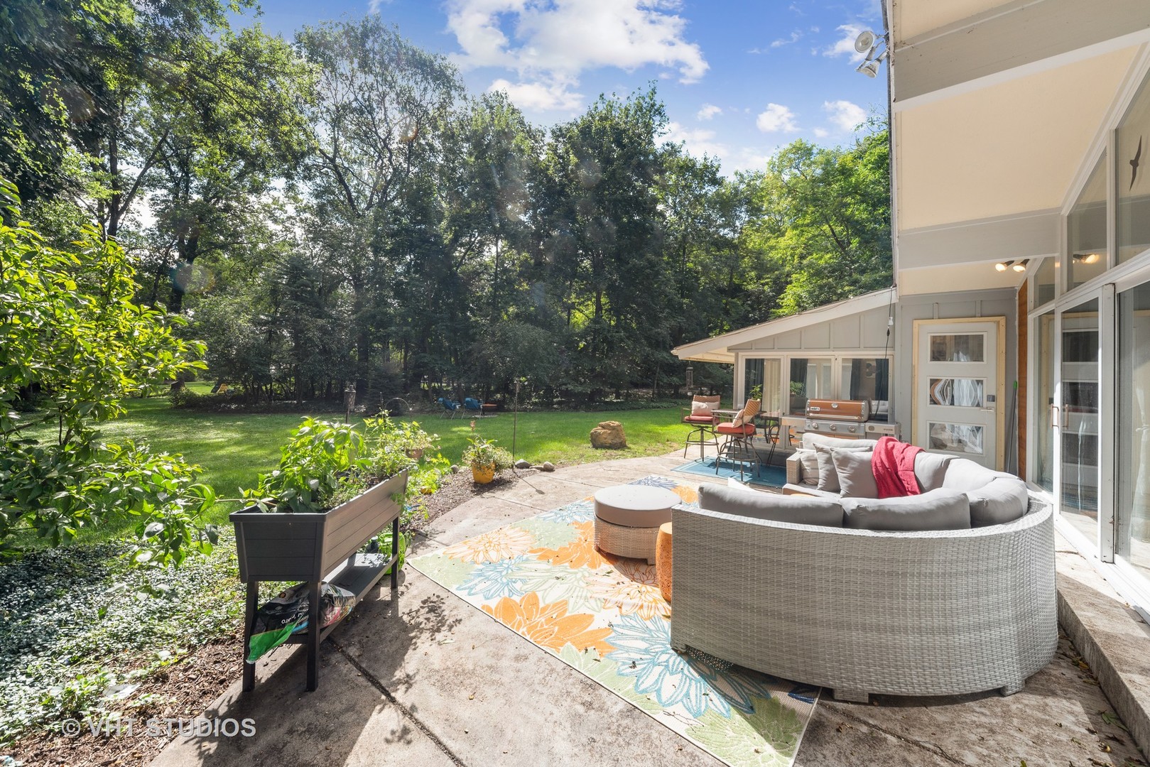 107 Trout Valley Road Trout Valley, IL 60013 - Photo 23 of 29 a patio with couches table and chairs and potted plants
