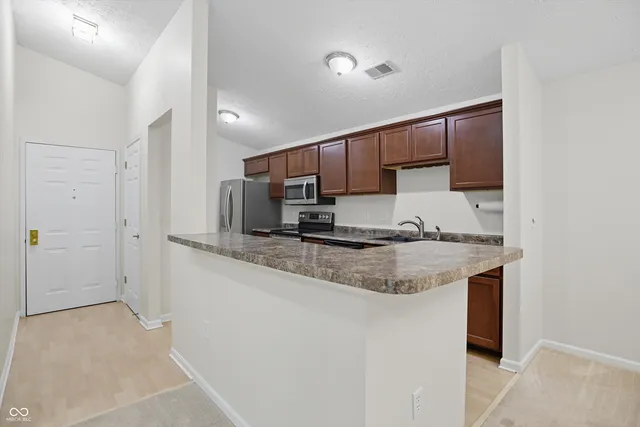 $240,000 | 11755 Beckham Court, Unit 206, Carmel, IN 46032