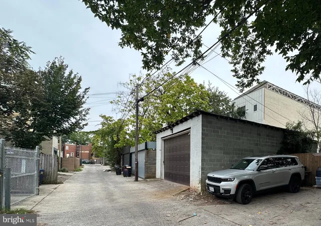 a view of a car parked in front of a house