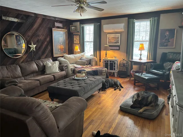 a living room with furniture and a window