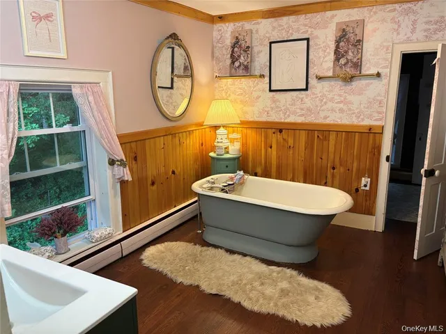 a bed room with a bed and a chair