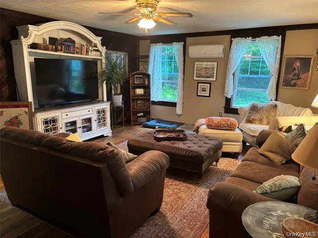 a living room with furniture and a window