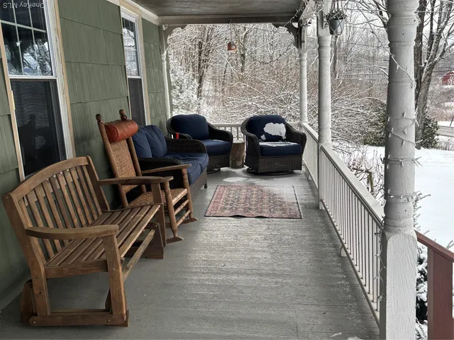 a view of balcony with furniture