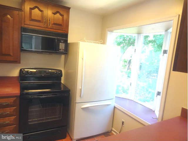 3007 Kramer Street Silver Spring, MD 20902 - Photo 3 of 20 a kitchen with a refrigerator stove and microwave