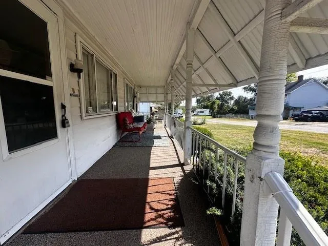 a view of a porch with seating space