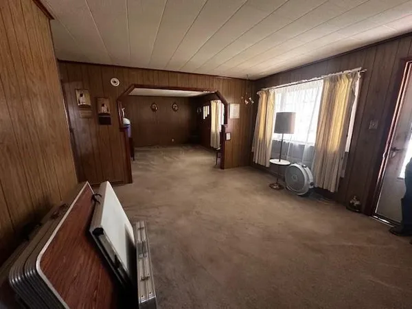 a view of a hallway with furniture